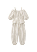 Off-Shoulder Peplum Jumpsuit in Linen in Natural — flat lay