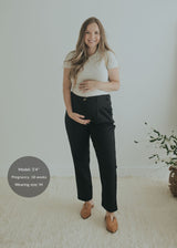 Model wearing the Adjustable Dress Pant in Ebony — cotton/wool maternity dress pant with tapered leg