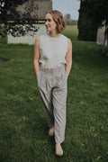Close front view of the Gray Adjustable Wide Leg Dress Pant showing the pleats and button waistband