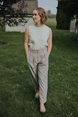 Close front view of the Gray Adjustable Wide Leg Dress Pant showing the pleats and button waistband
