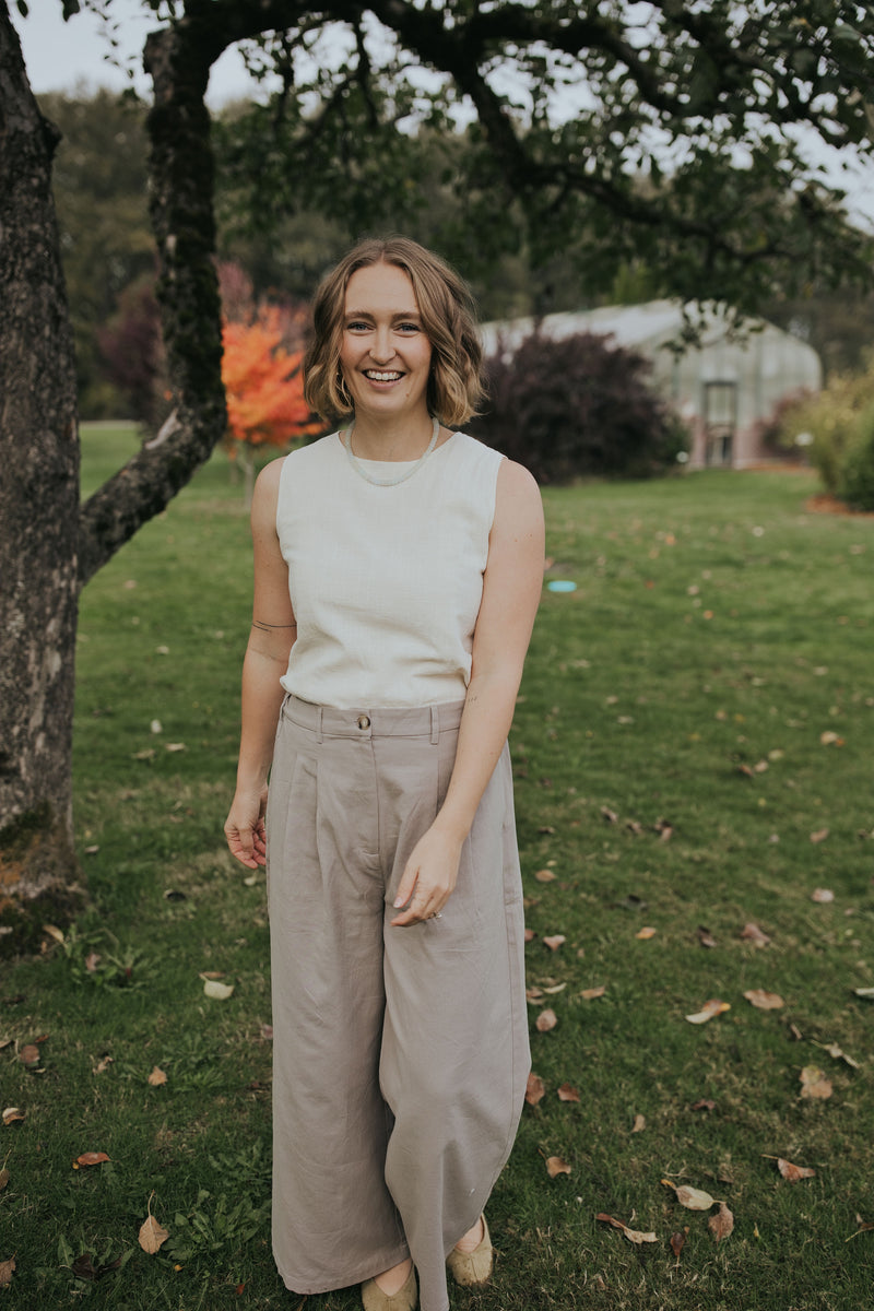 Smiling woman in the Gray Adjustable Wide Leg Dress Pant, front view showing the pleats