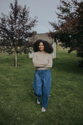 Woman in the Indigo Balloon Jean Pant with a cropped oatmeal sweater, front view, full length