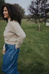 Close side view of the Indigo Balloon Jean Pant showing the waistband and pocket