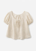 Tie-Neck Puff-Sleeve Cropped Linen Blouse in Linen in Natural — flat lay