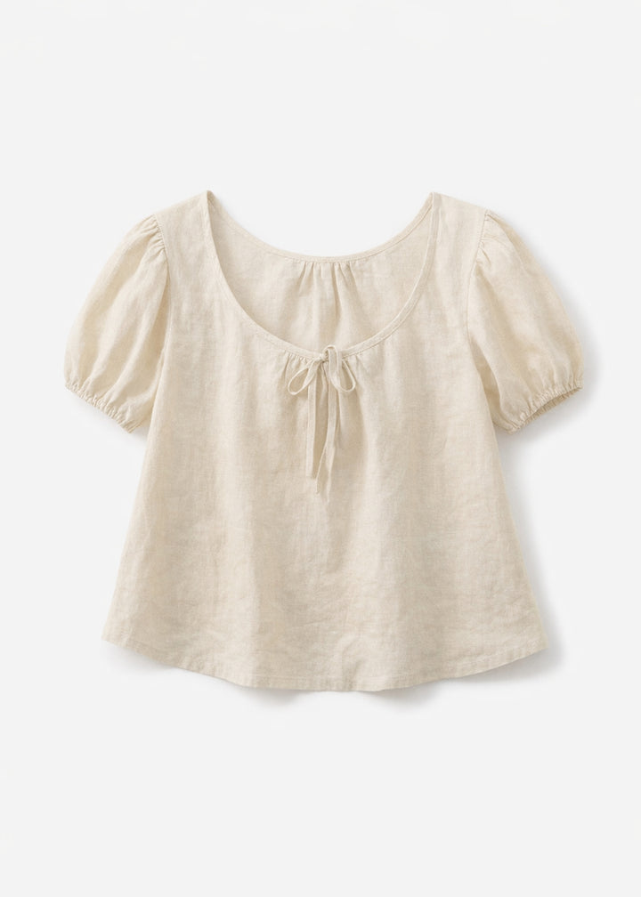 Tie-Neck Puff-Sleeve Cropped Linen Blouse in Linen in Natural — flat lay
