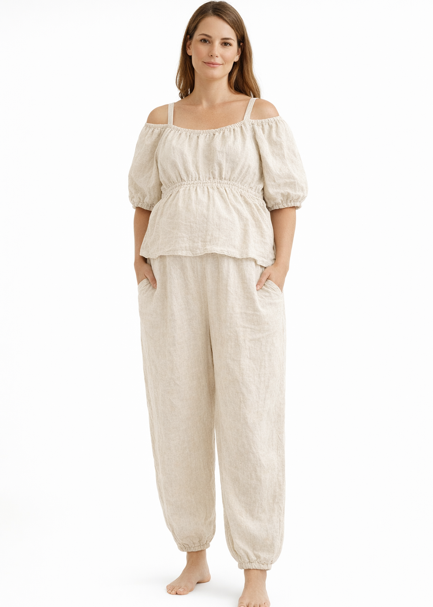 Off-Shoulder Peplum Jumpsuit in Linen in Natural — on model