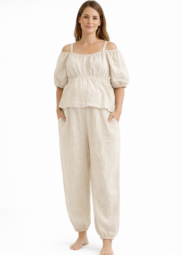 Off-Shoulder Peplum Jumpsuit in Linen in Natural — on model