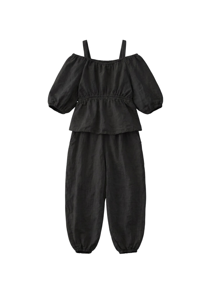 Off-Shoulder Peplum Jumpsuit in Linen in Black — flat lay