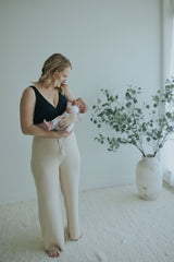 Woman in the Black Crossover Sleep Bra with ribbed knit wide-leg pants, full length