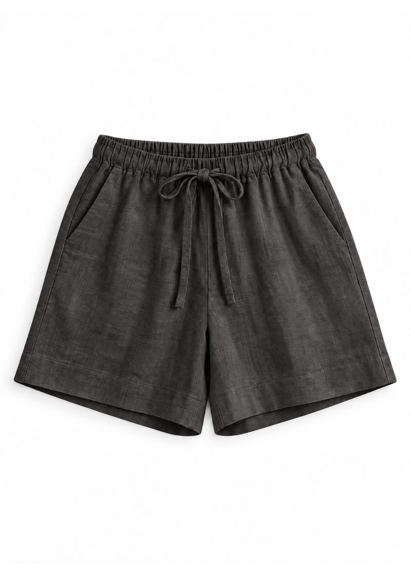 Drawstring Shorts in ebony sandwashed linen, flat lay.
