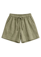 Drawstring Shorts in olive sandwashed linen, flat lay.