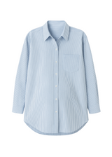 Light blue and white striped oversized cotton/linen button-down shirt with a single chest pocket.