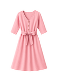 Pink linen Faye dress with V-neck, front buttons, 3/4 sleeves, and a tied waist sash.