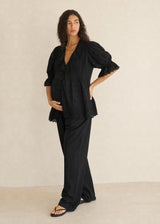 Eyelet Ruffle Puff Sleeve Blouse in Cotton in Black — on model