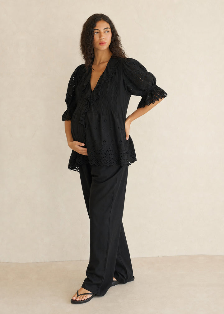 Eyelet Ruffle Puff Sleeve Blouse in Cotton in Black — on model