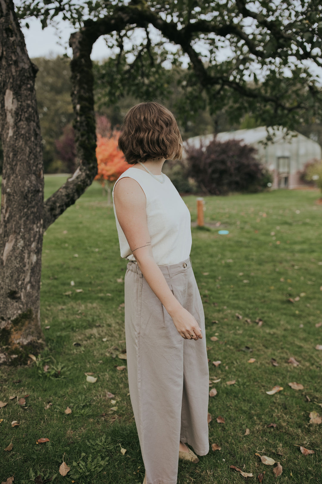 Side view of the Beige Haven Lift Top showing the sleeveless cut