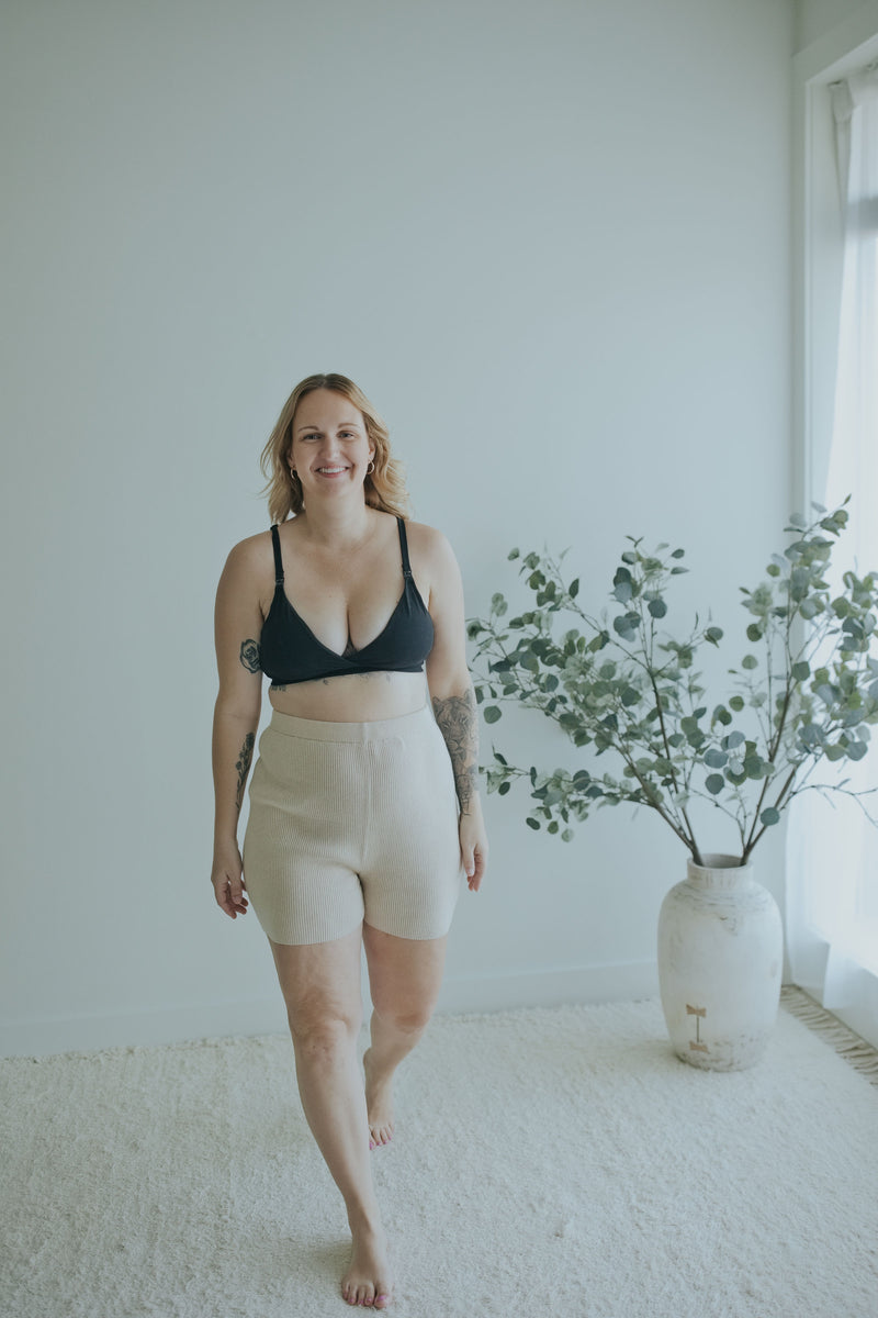 Woman walking in the Oatmeal Knit Shorts in Cotton Cashmere
