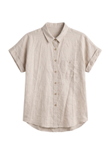 Nora Camp Shirt in natural sandwashed linen, flat lay with point collar, chest pocket and cuffed short sleeves.