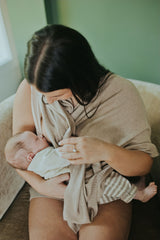 Mother nursing her baby with the Mocha Nursing Cover