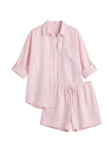 Oversized pink linen co-ord set with a button-up shirt and drawstring shorts.