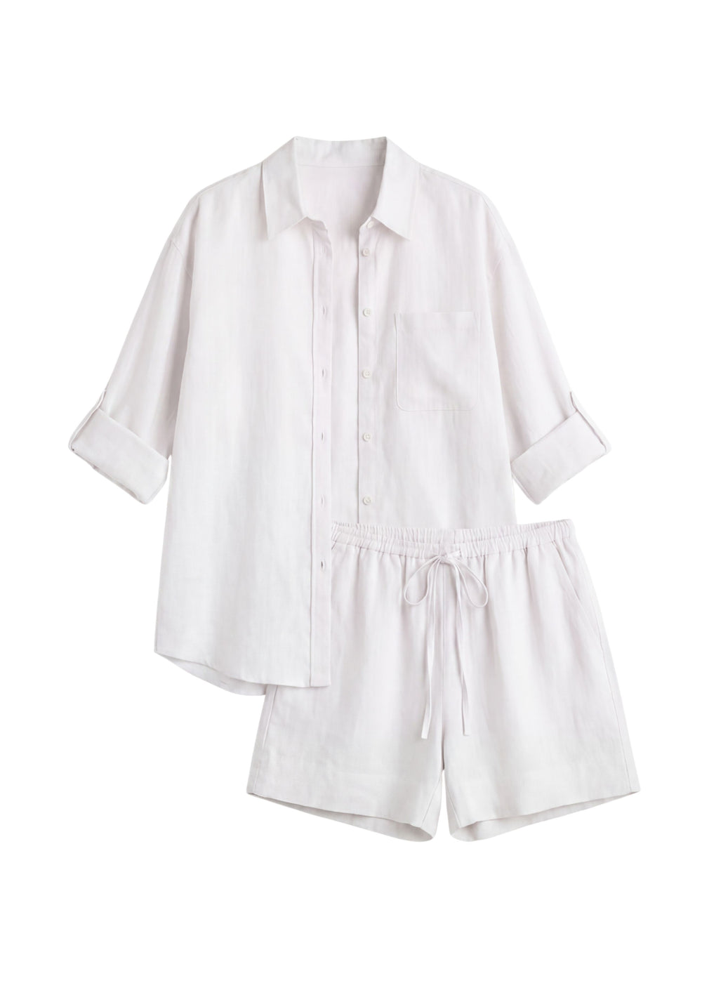 Oversized white linen co-ord set with a button-up shirt and drawstring shorts.