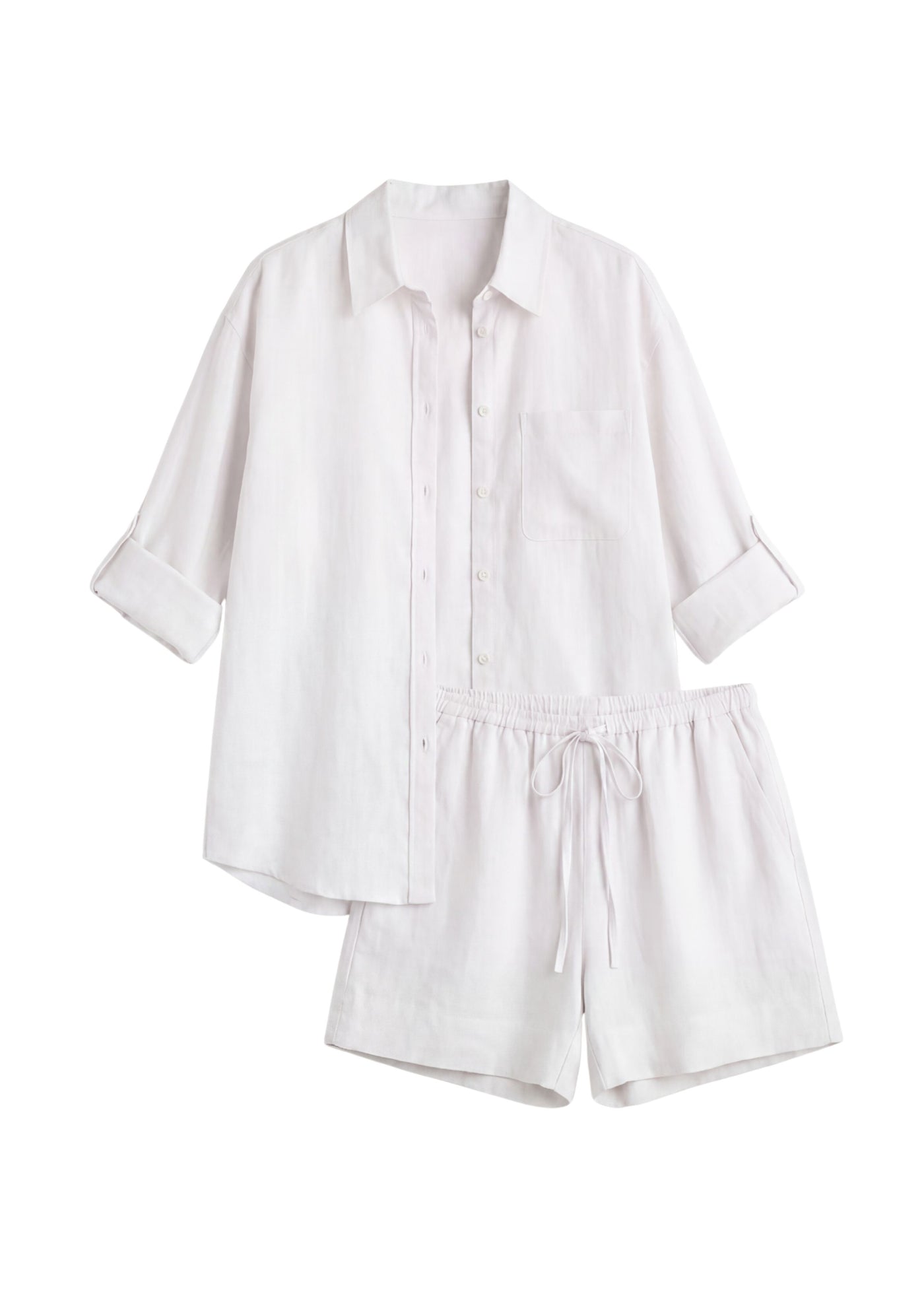 Oversized white linen co-ord set with a button-up shirt and drawstring shorts.