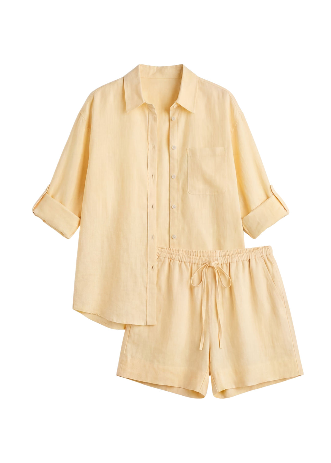 Oversized everyday linen co-ord in light yellow, featuring a relaxed button-up shirt with rolled sleeves and shorts with a drawstring waist.