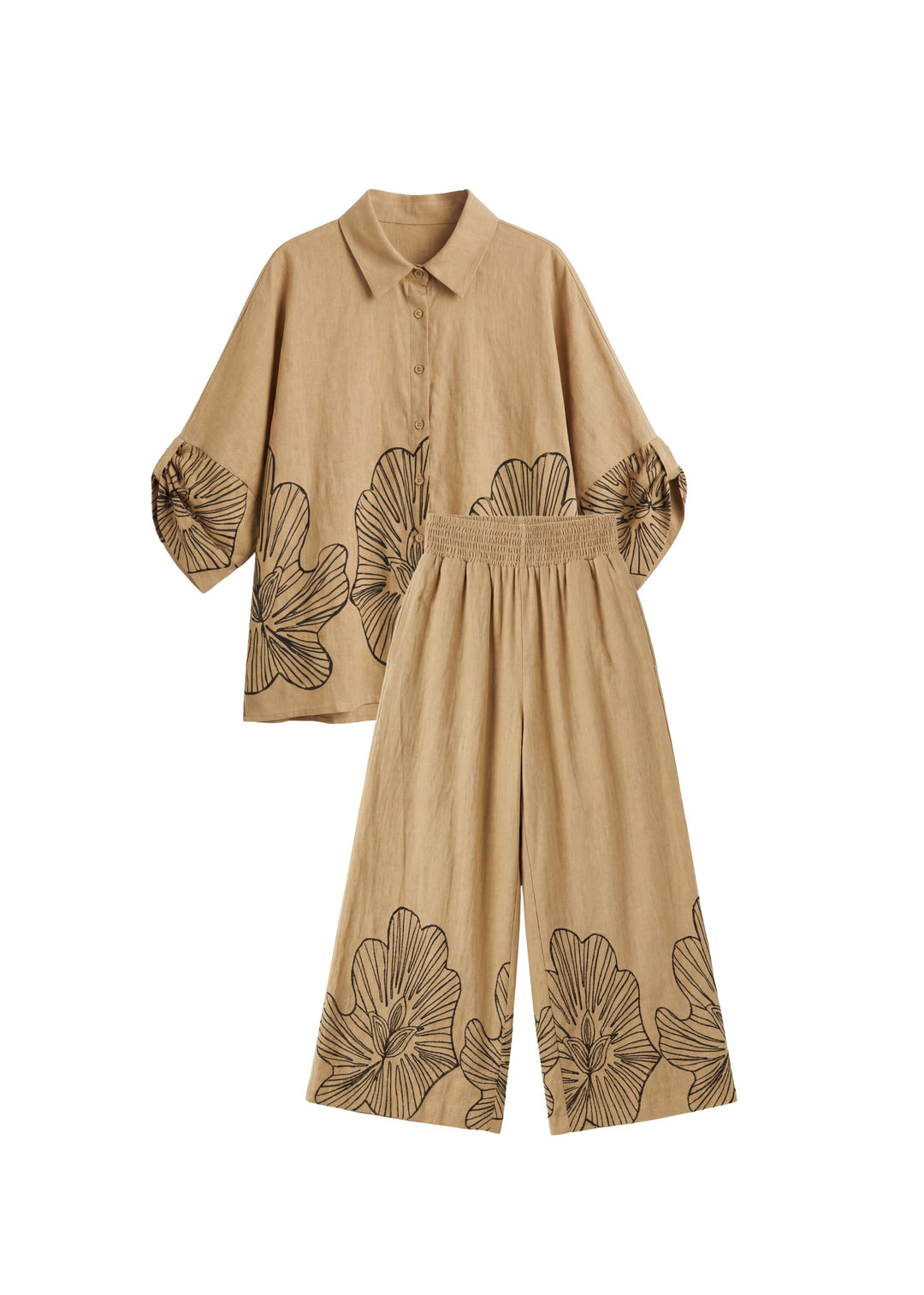 Oversized tan cotton smocked set with black floral print, featuring a collared shirt and wide-leg pants.