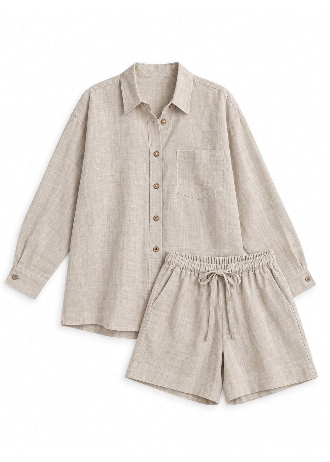 Oversized Co-ord in natural sandwashed linen, flat lay of the long-sleeve button-up shirt and drawstring shorts.