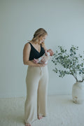 Woman in the Oatmeal Ribbed Knit Wide-Leg Pants, full length