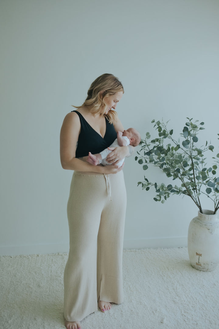 Woman in the Oatmeal Ribbed Knit Wide-Leg Pants, full length