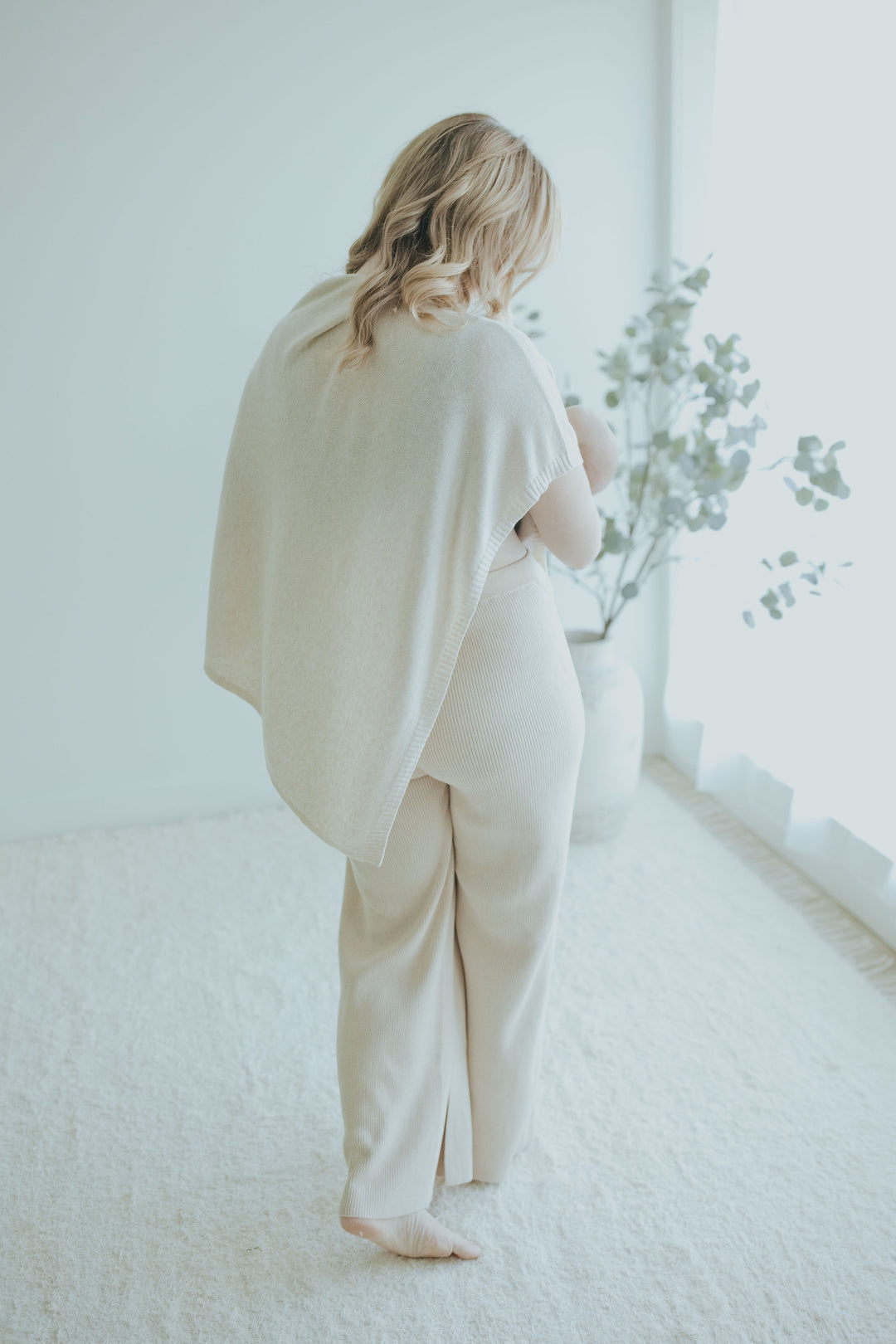 Back view of the Oatmeal Ribbed Knit Wide-Leg Pants worn with the nursing cover