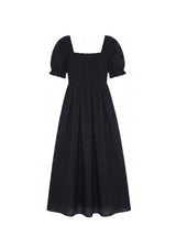 Black cotton gauze maxi dress with square neck, smocked bodice, and puffed sleeves.