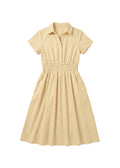Light yellow cotton poplin Sarah Shirt Dress with short sleeves, collar, button placket, and shirred waist.