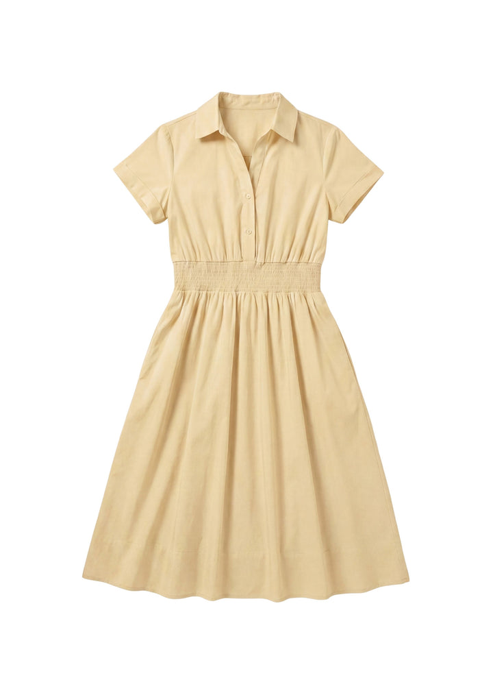 Light yellow cotton poplin Sarah Shirt Dress with short sleeves, collar, button placket, and shirred waist.