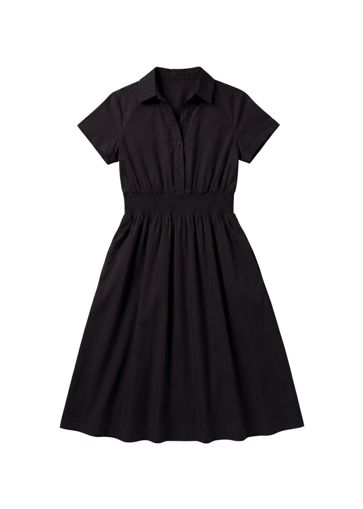 Black cotton poplin Sarah shirt dress with short sleeves, collar, and shirred elastic waist.