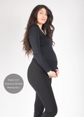 Pregnant woman in black Dressy Stretch Ponte Pant, ankle-length, with contoured waistband.