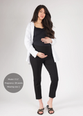Pregnant woman in black Dressy Stretch Ponte Pants, black top, and white shirt.