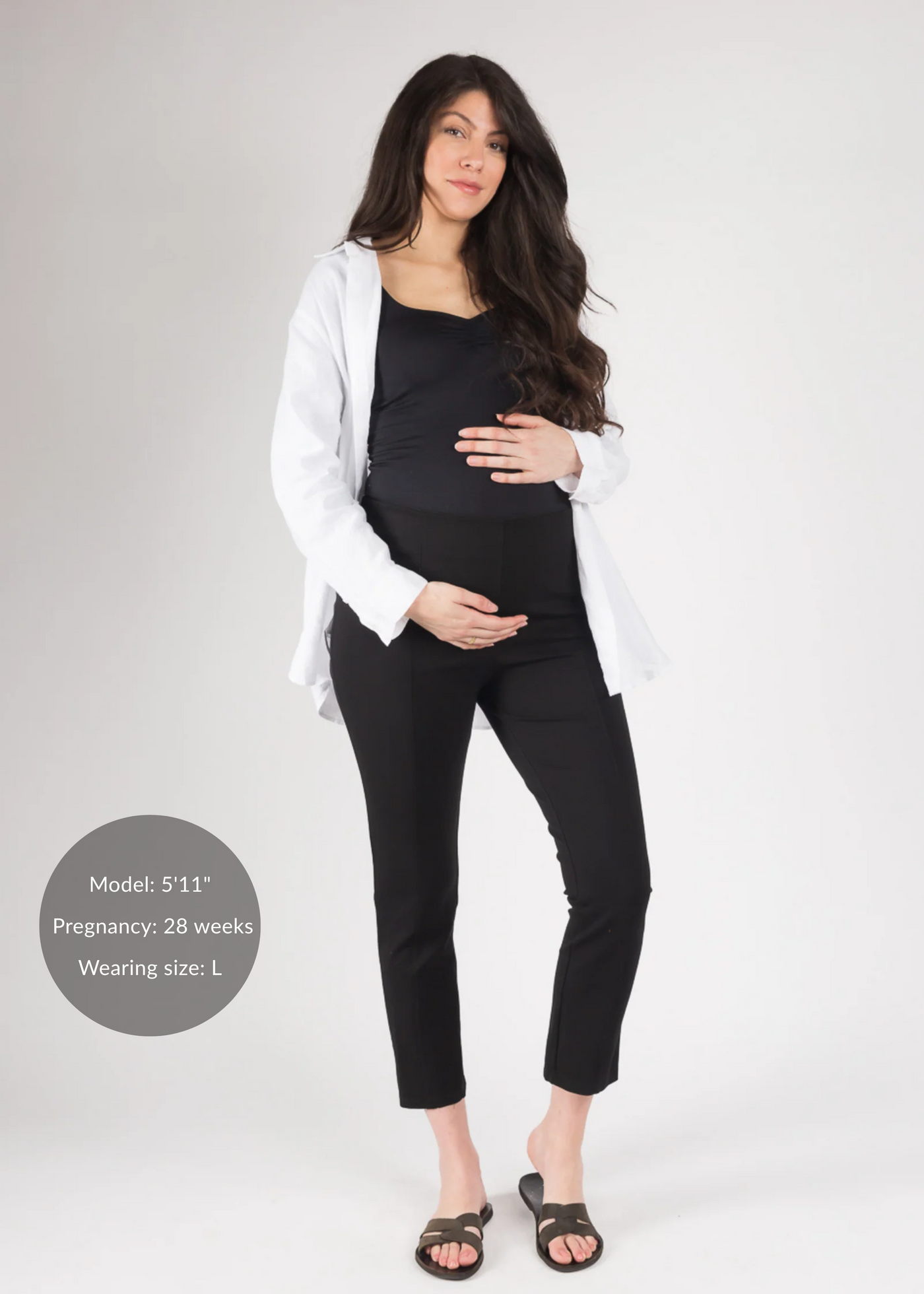 Pregnant woman in black Dressy Stretch Ponte Pants, black top, and white shirt.