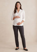 Smiling pregnant woman in a white blouse and dark gray Dressy Stretch Ponte Pant.