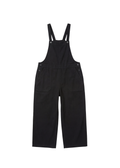 Black linen/cotton Journey Overalls with adjustable straps, side buttons, and deep front pockets.