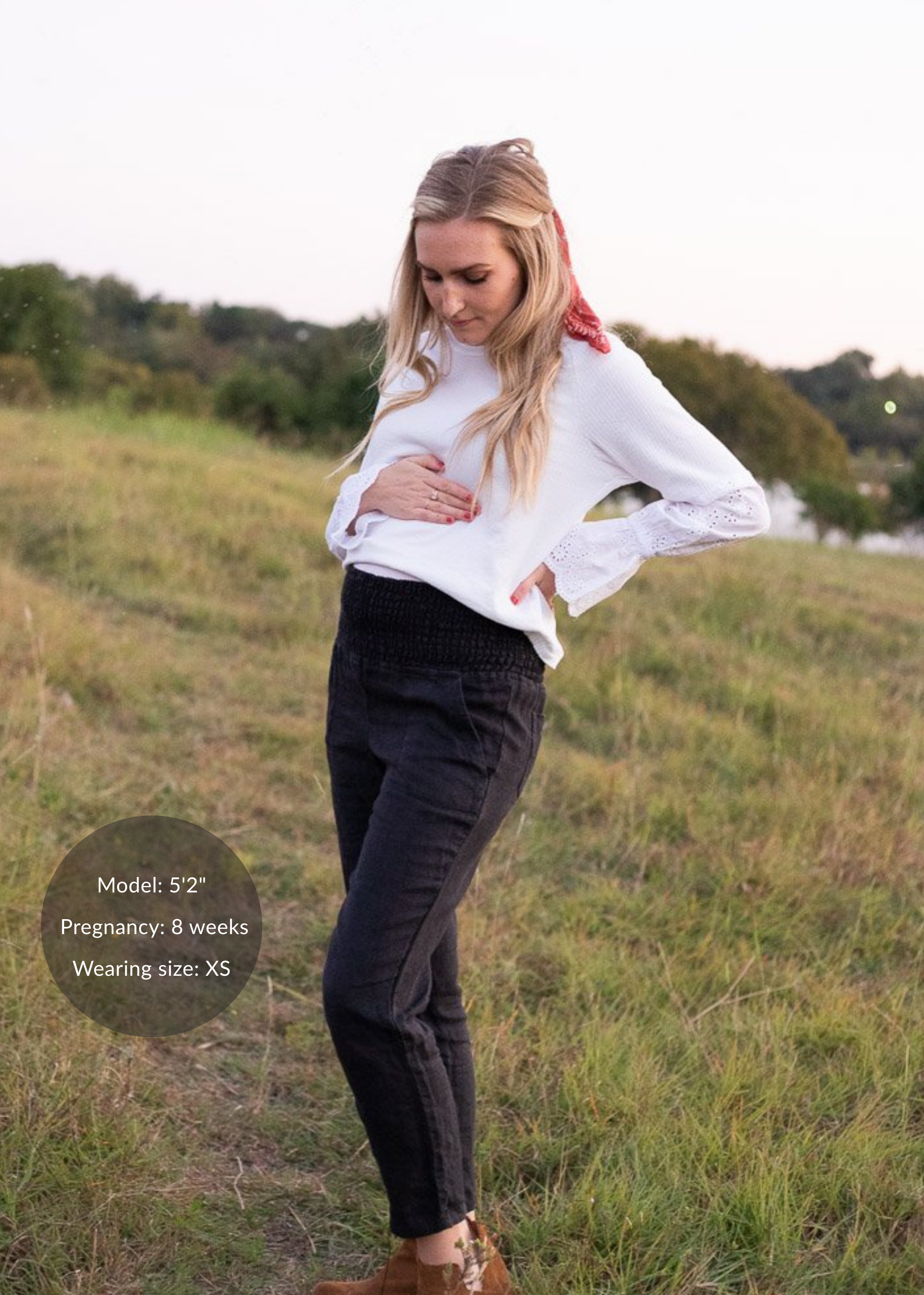 Mother in black linen pants standing in a field