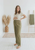Model wearing the Transitional Straight Leg Smocked Pant in Reedcloth in Olive — smocked waistband maternity pant