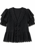Eyelet Ruffle Puff Sleeve Blouse in Cotton in Black — flat lay