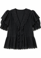 Eyelet Ruffle Puff Sleeve Blouse in Cotton in Black — flat lay