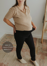 Pregnant woman wearing black Dressy Stretch Ponte Pants with a contoured waistband.