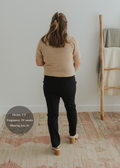 Pregnant woman wearing black Dressy Stretch Ponte Pants with a contoured waistband.