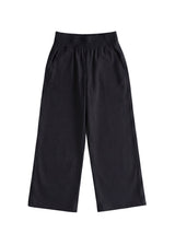 Black wide-leg flow pant in cotton/linen blend, featuring an elastic waist and side pockets.