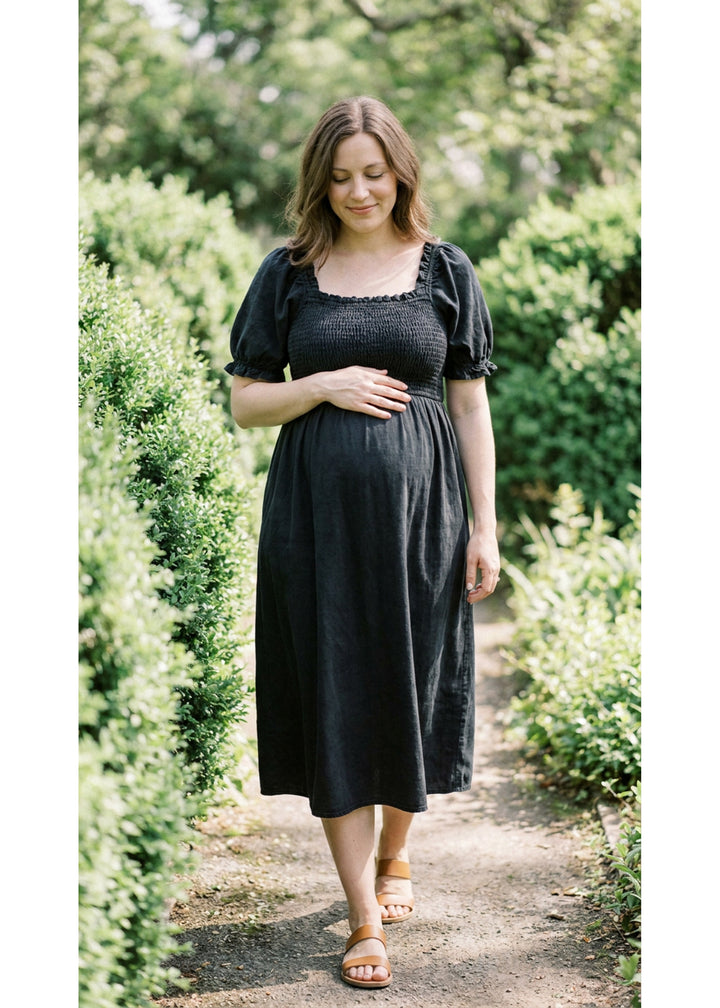 Smocked Short Sleeve Maternity Midi Dress in Cotton/Linen in Black — on model