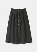 Brass-Snap Gathered A-Line Linen Midi Skirt in Linen in Black — flat lay